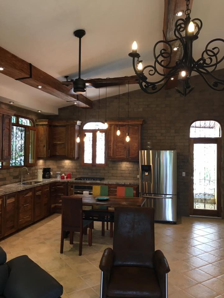 Kitchen with a Wire Cut Gray brick veneer wall