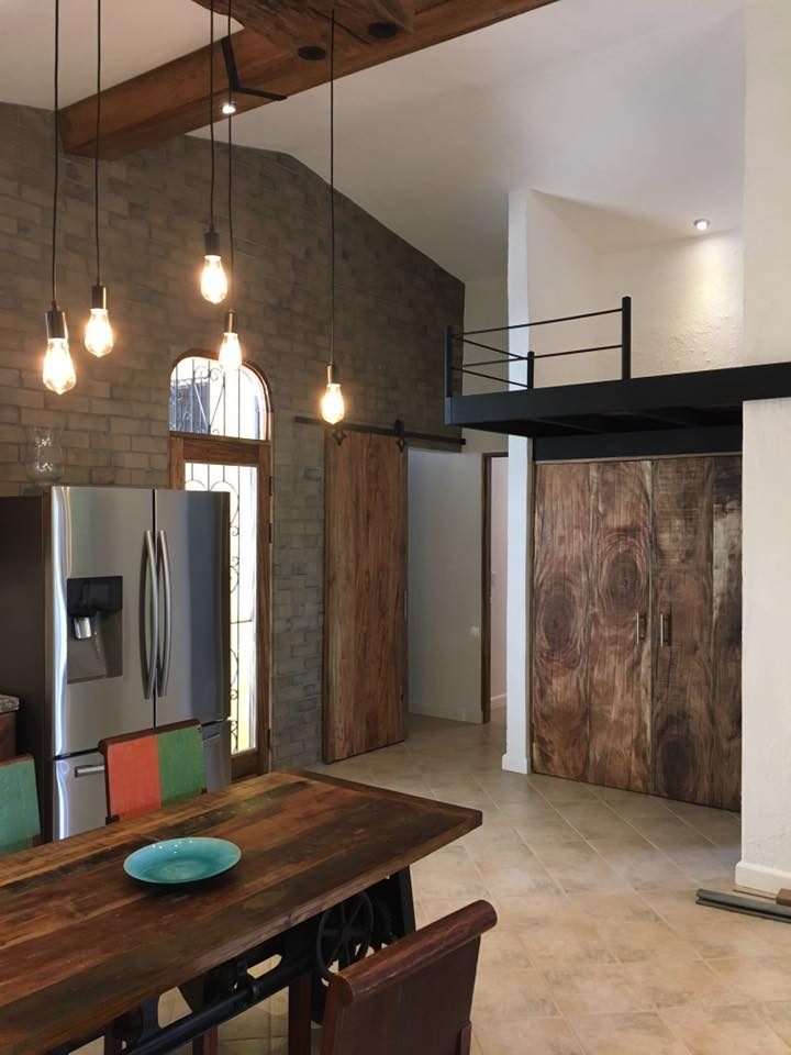 Double-height living room with a Wire Cut Gray brick veneer wall